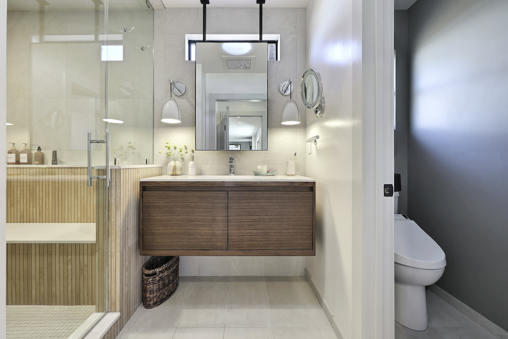 Custom primary bathroom with water closet in full house remodel
